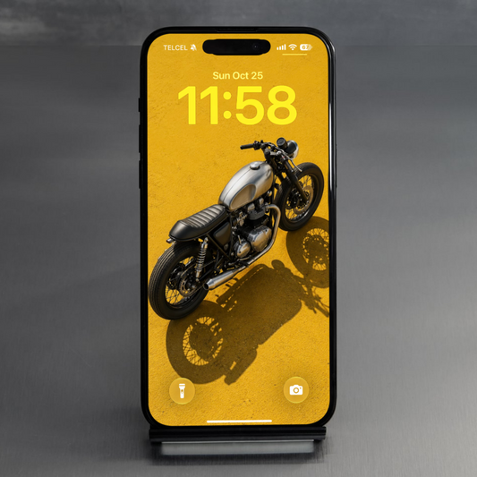 Phone on a studio stand displaying Midnight Rider motorcycle wallpaper on a yellow background.