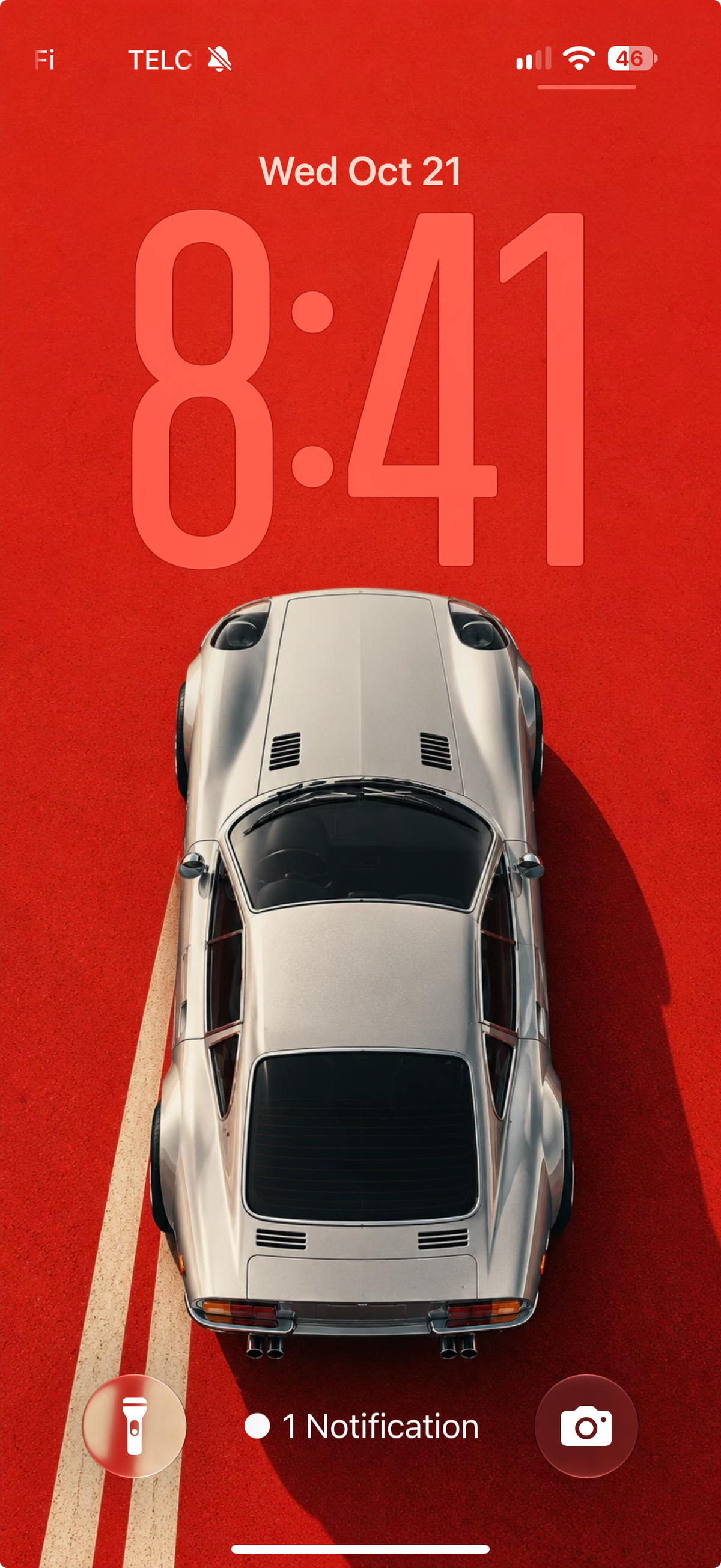 Retro Drive lock screen preview with silver sports car, vivid red background and cream road stripes.